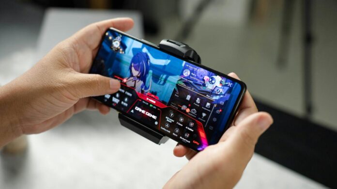 A person holding a cell phone in their hand