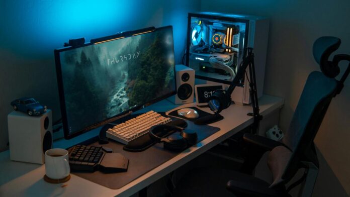 a computer desk with a monitor and keyboard